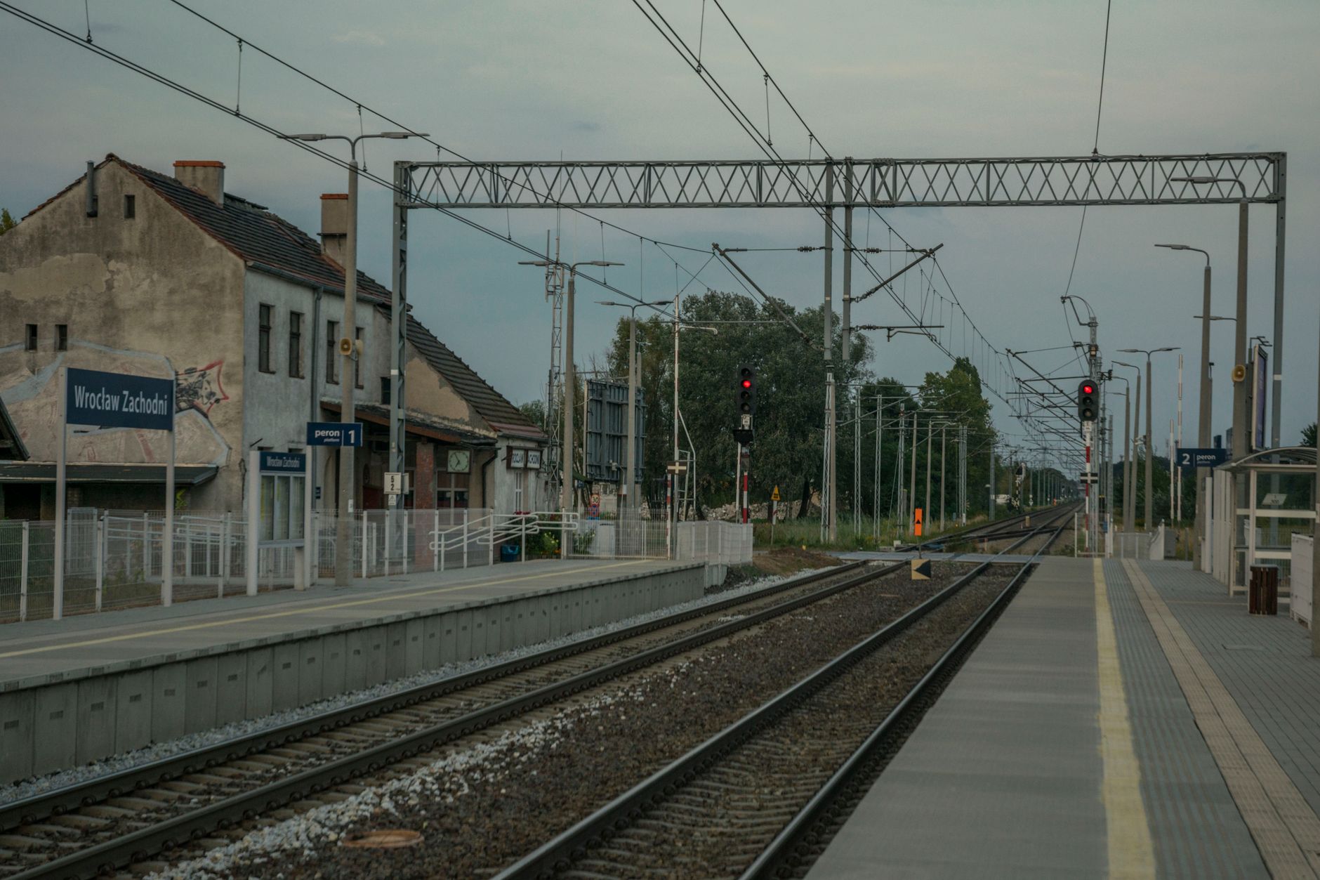View of Wrocław Zachodni railway station with tracks and platforms on a clear day.
