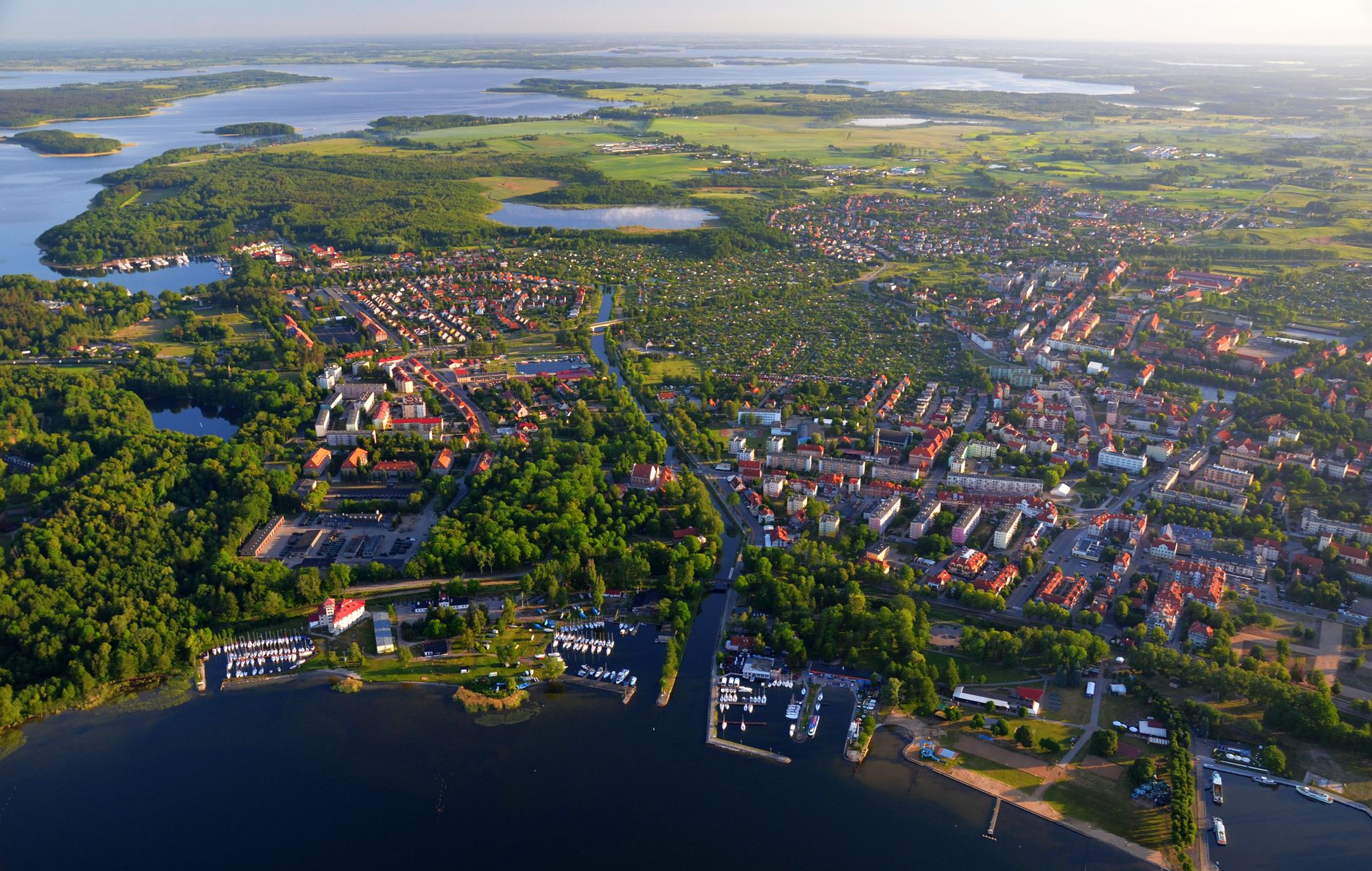 Stunning aerial view of Giżycko, Poland, showcasing urban and natural landscapes.