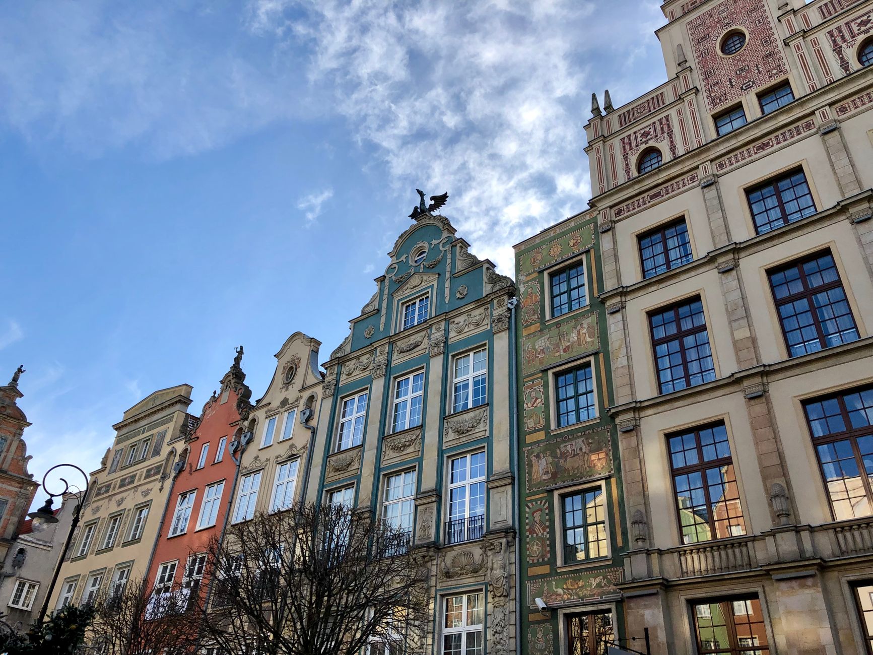 Ornate historic facades in Gdańsk's old town under a clear sky.