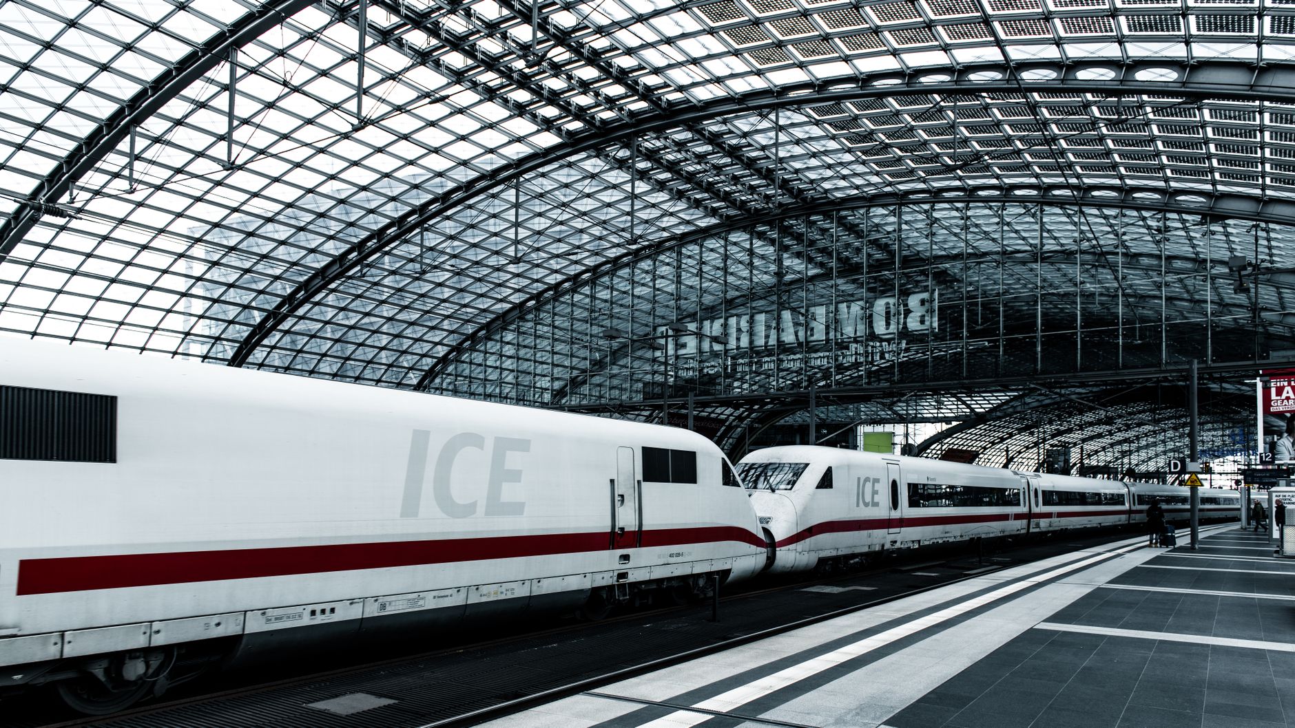 ICE train at Berlin Hauptbahnhof showcasing modern architecture and transportation.