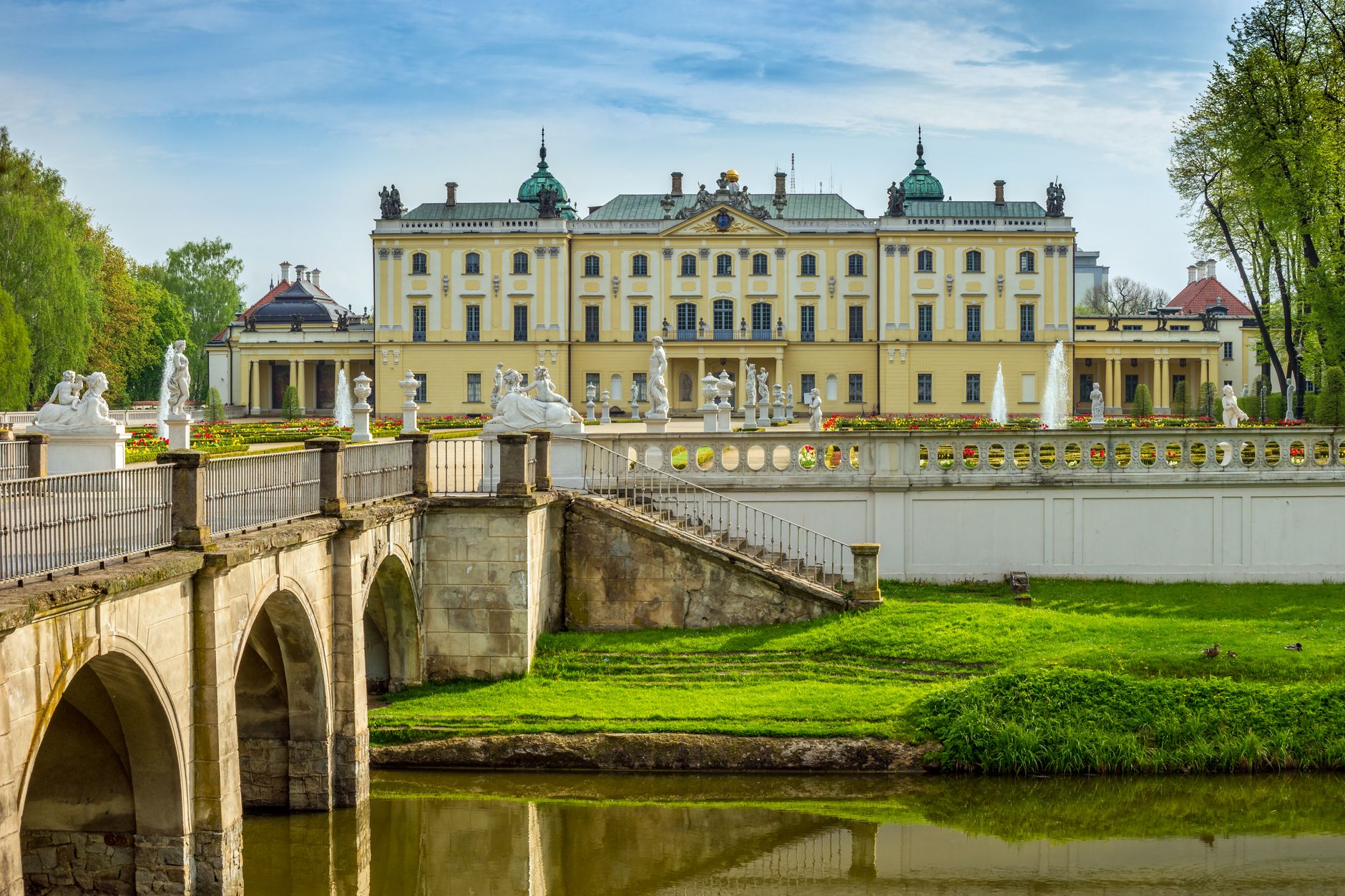 Scenic view of Branicki Palace in Bialystok, Poland, featuring the exquisite gardens and elegant architecture.
