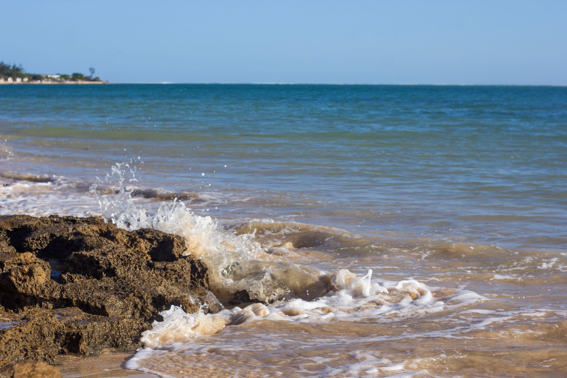 Tranquil beach with turquoise waters and waves at Ifaty, Madagascar.