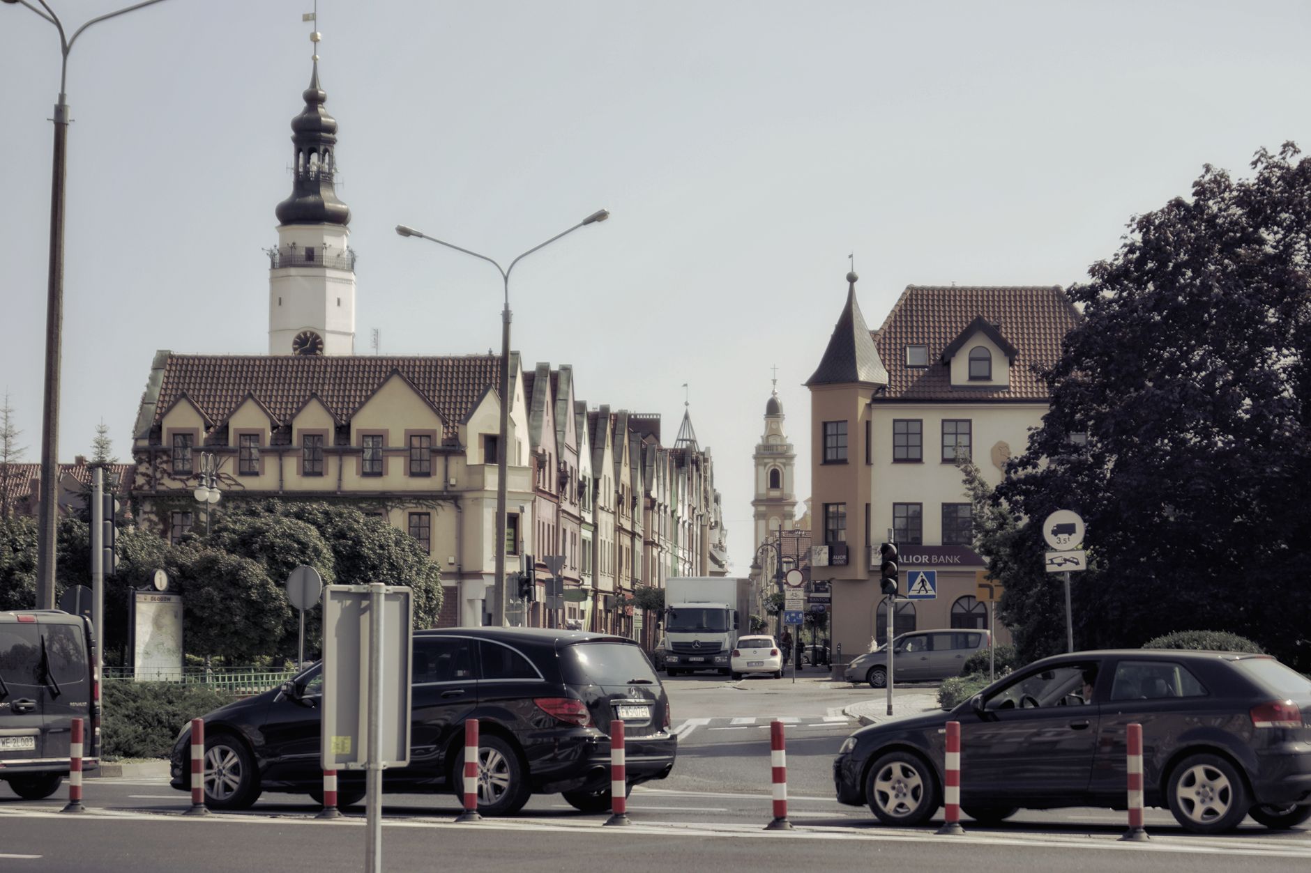 Picturesque street scene in Głogów, featuring historic architecture and bustling urban life.