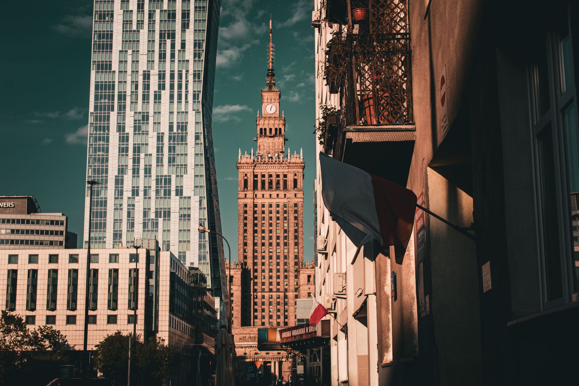 Stunning Warsaw cityscape showcasing the iconic Palace of Culture and Science in warm light.