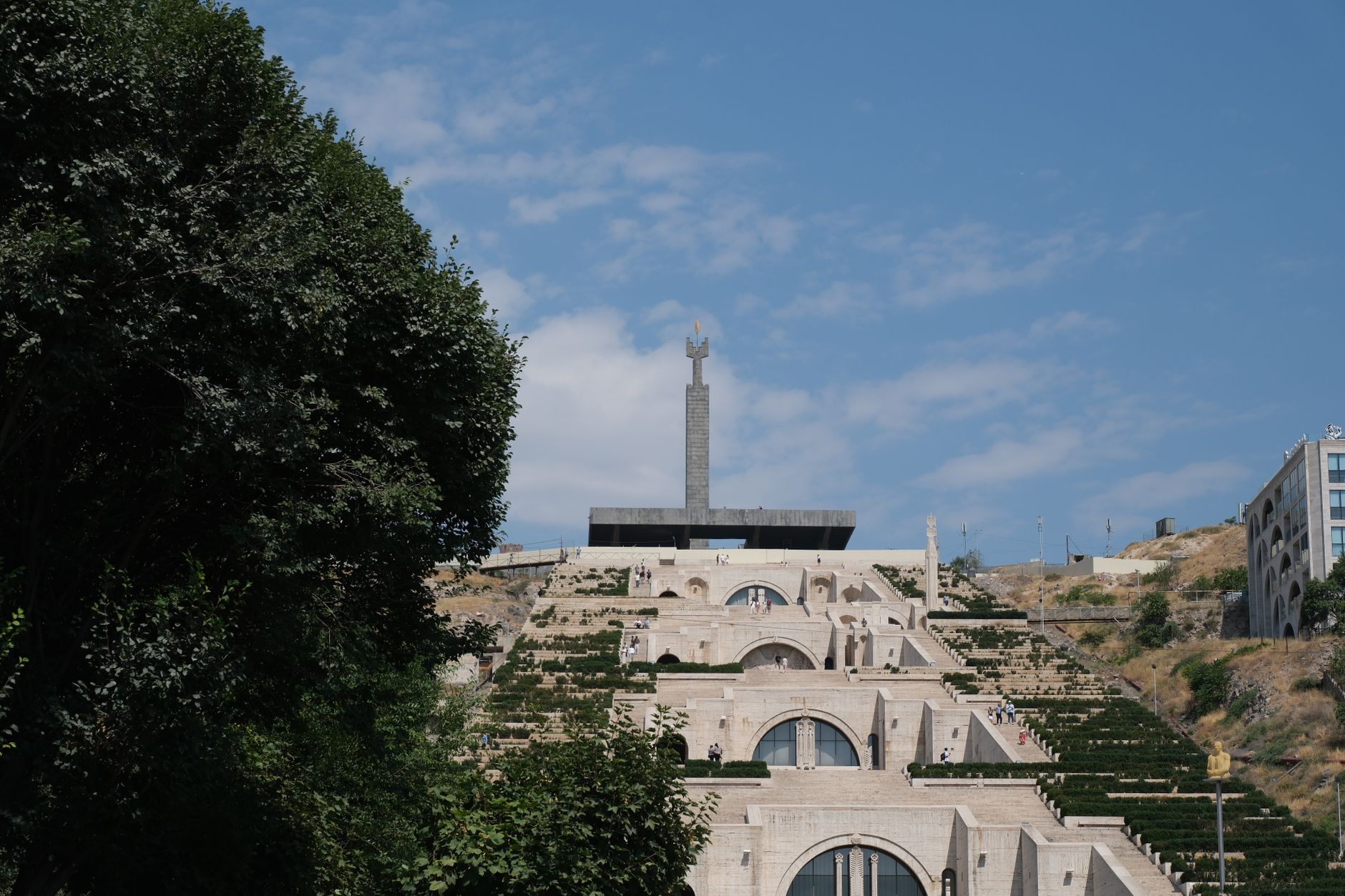Scenic view of the iconic Cascade Complex in Yerevan, Armenia, under a clear blue sky.