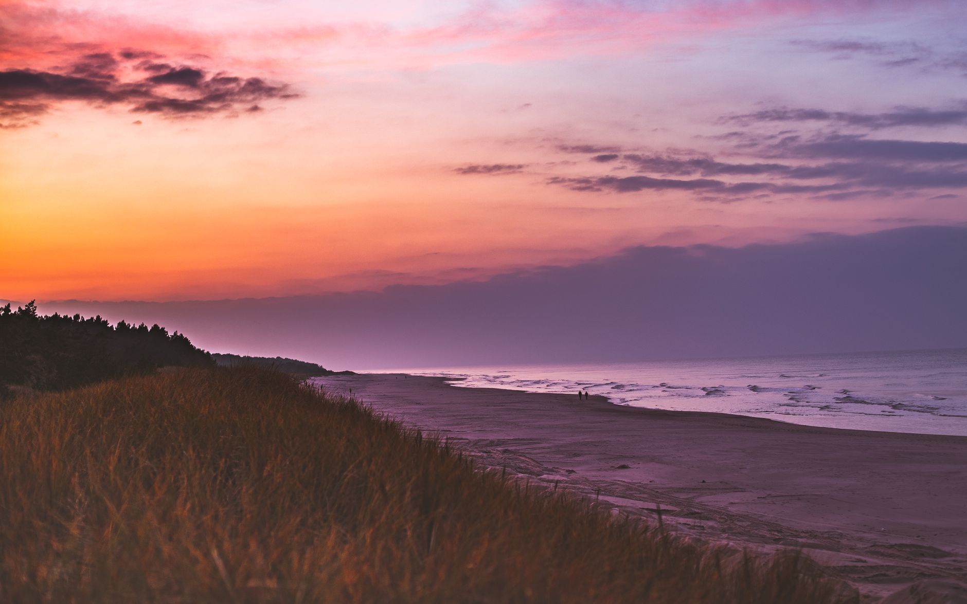 Stunning sunset over the Baltic Sea at Krynica Morska beach, Poland, capturing vibrant colors and serene landscape.