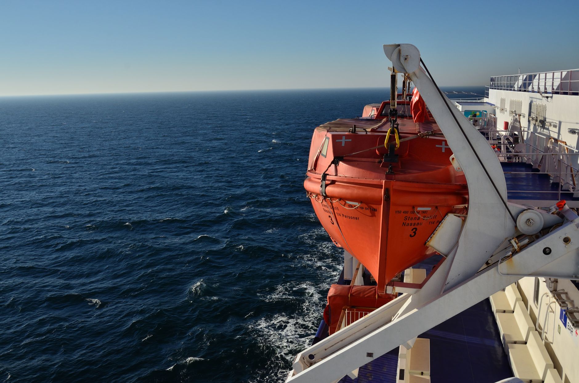 A ferry with lifeboats cruises through the vast ocean near Karlskrona, Sweden.